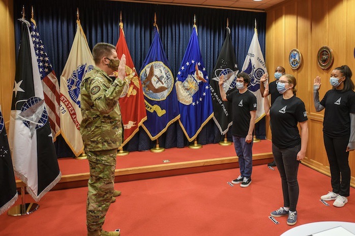 The Vice Chief of Space Operations Gen. David D. “DT” Thompson swears in the first four Space Force recruits at the Baltimore Military Entrance Processing Station, Fort George Meade, Md.